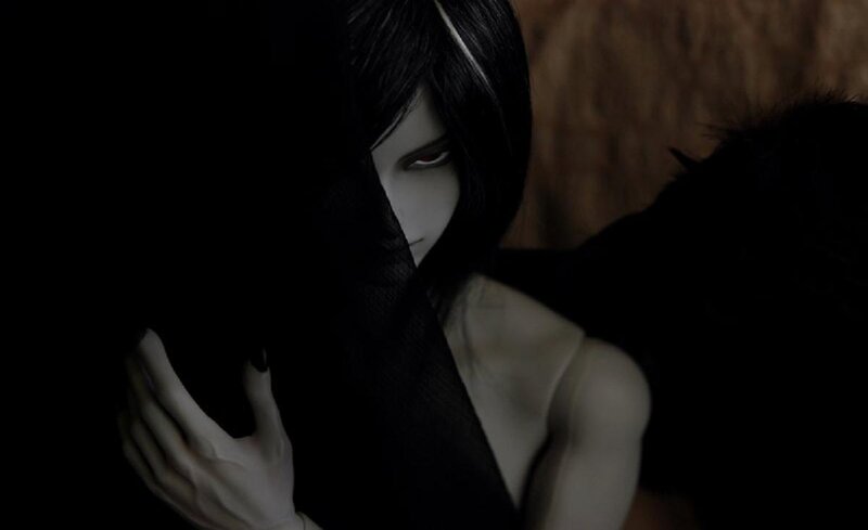 doll with dark hair and red eyes