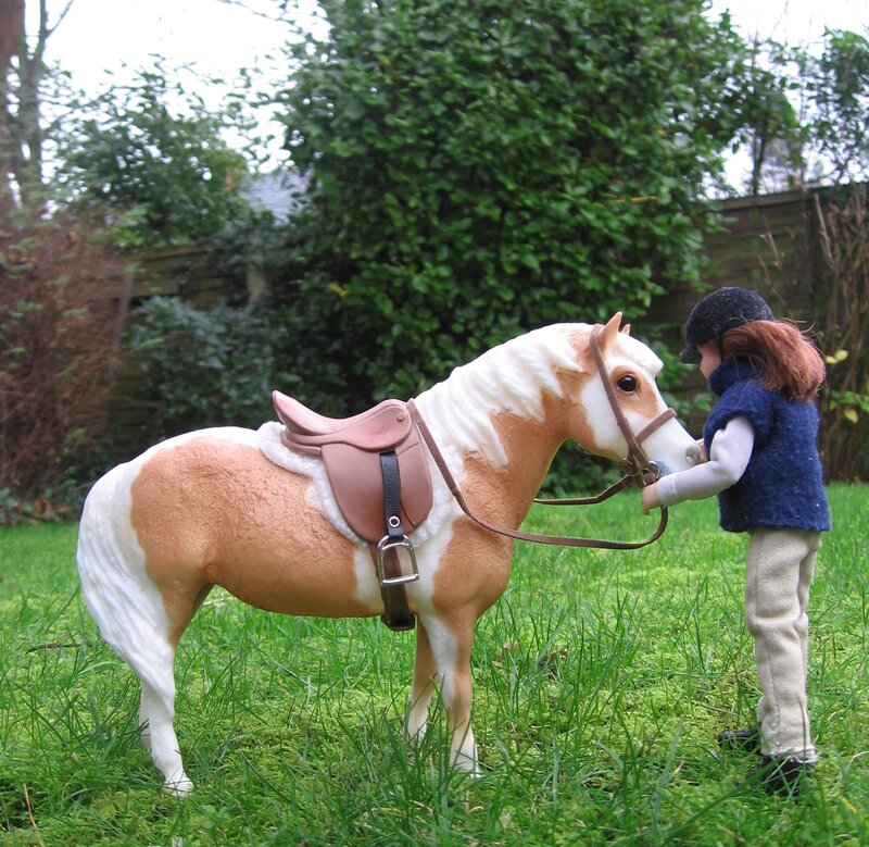 doll with horse in garden