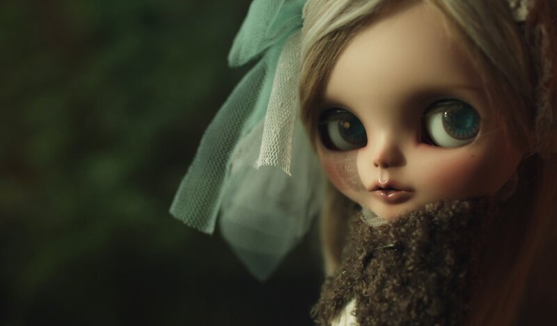 doll with large eyes and veil