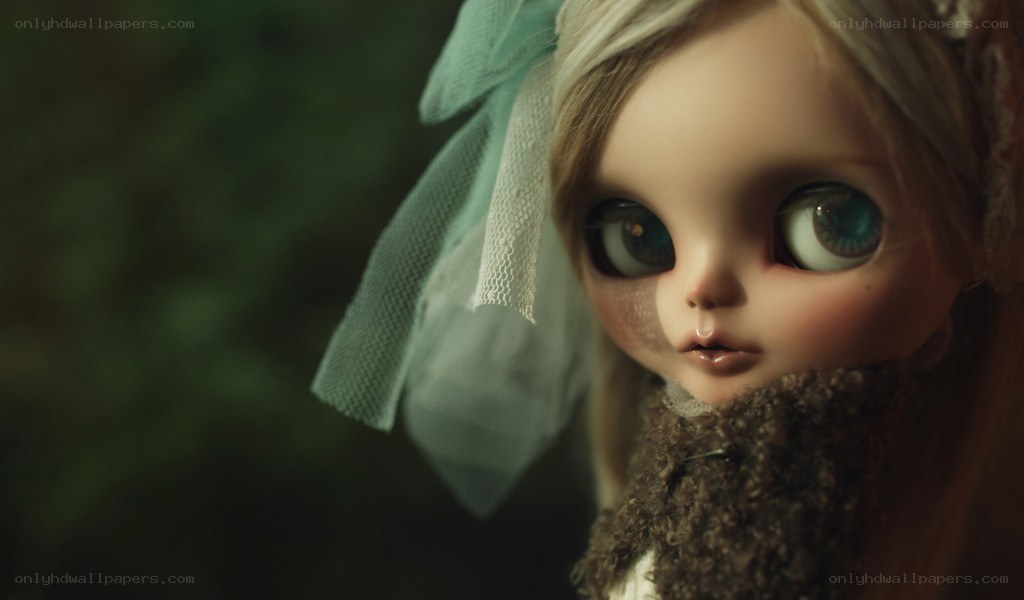 doll with large eyes and veil