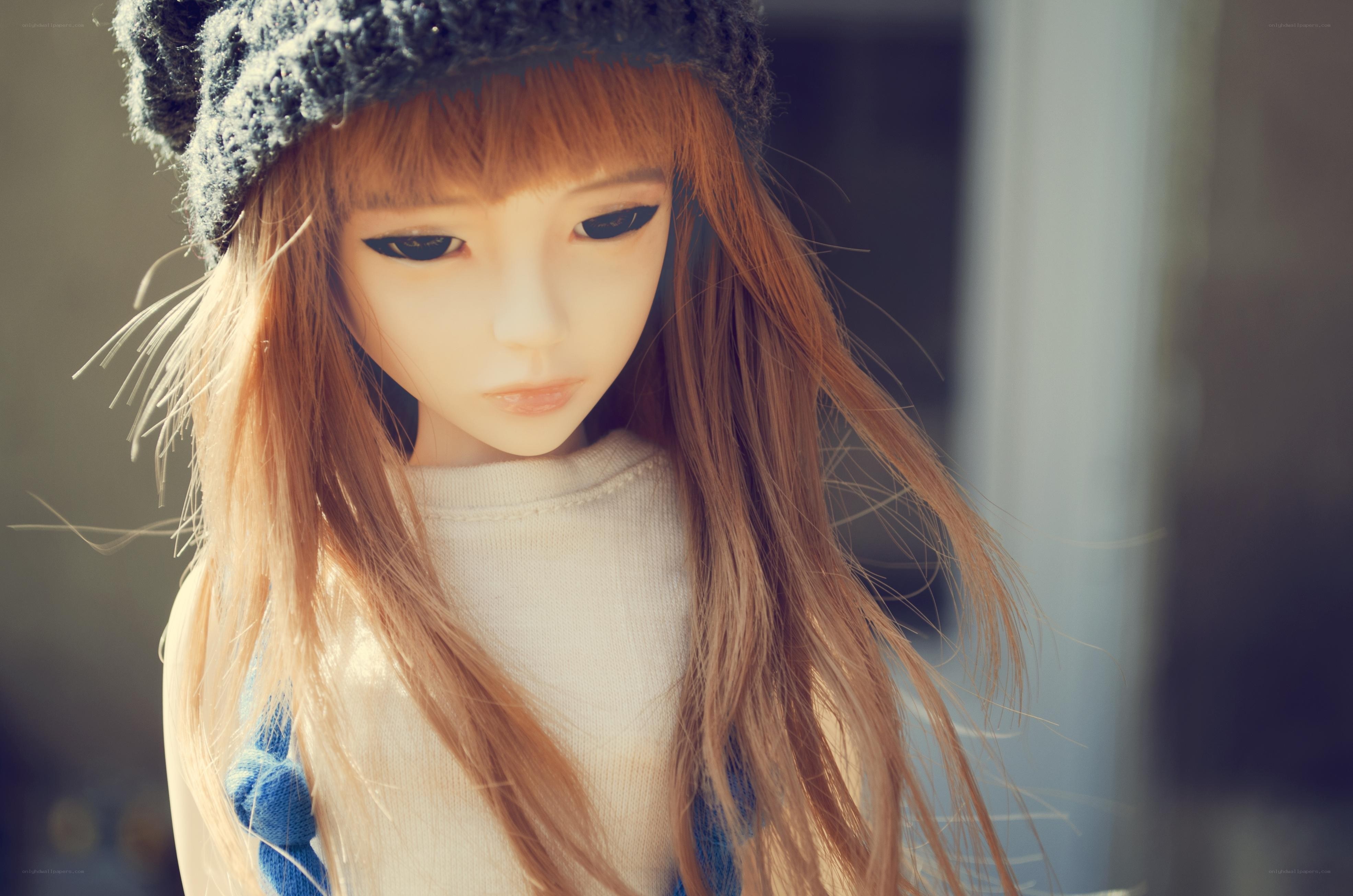 doll with long hair and hat