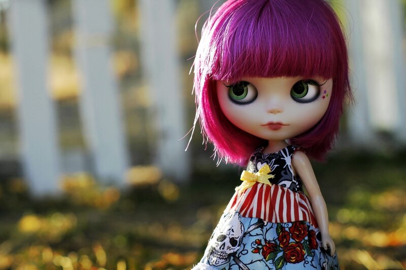 doll with purple hair outdoors