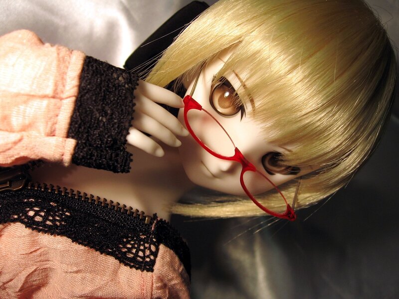 doll with red glasses