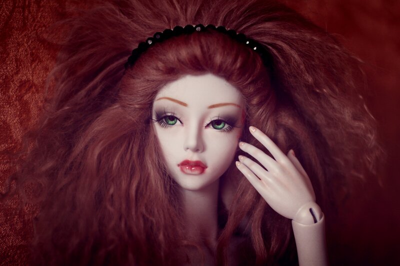 Doll with Red Hair — Dramatic, Photograph, Hand
