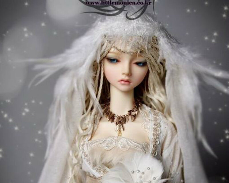 Doll with White Feathers