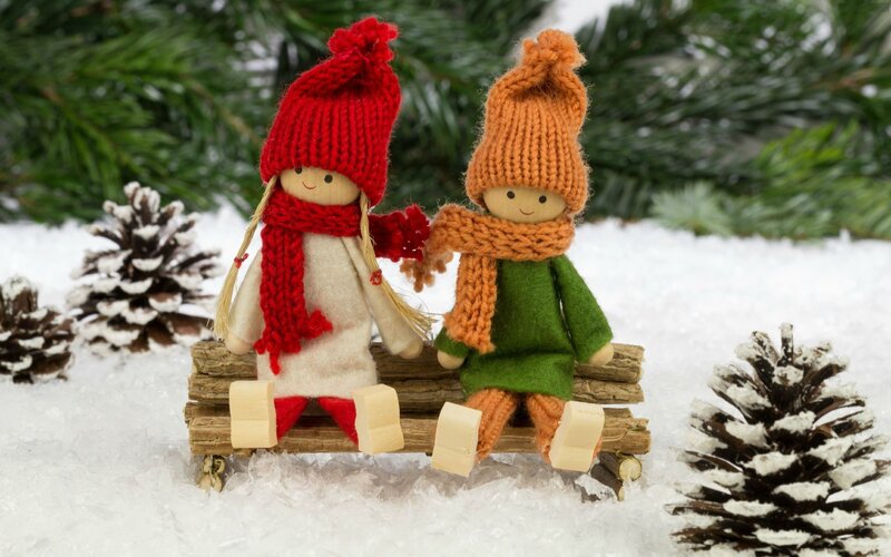 Dolls on Sled in Snow — White