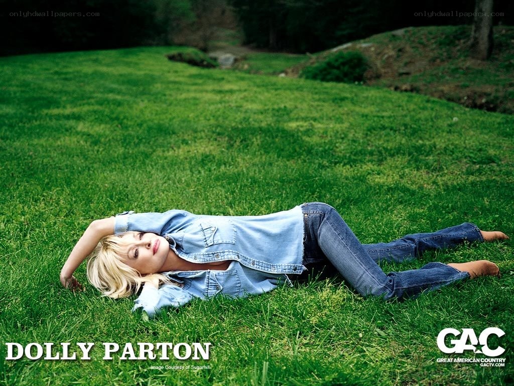 Dolly Parton on a grassy field