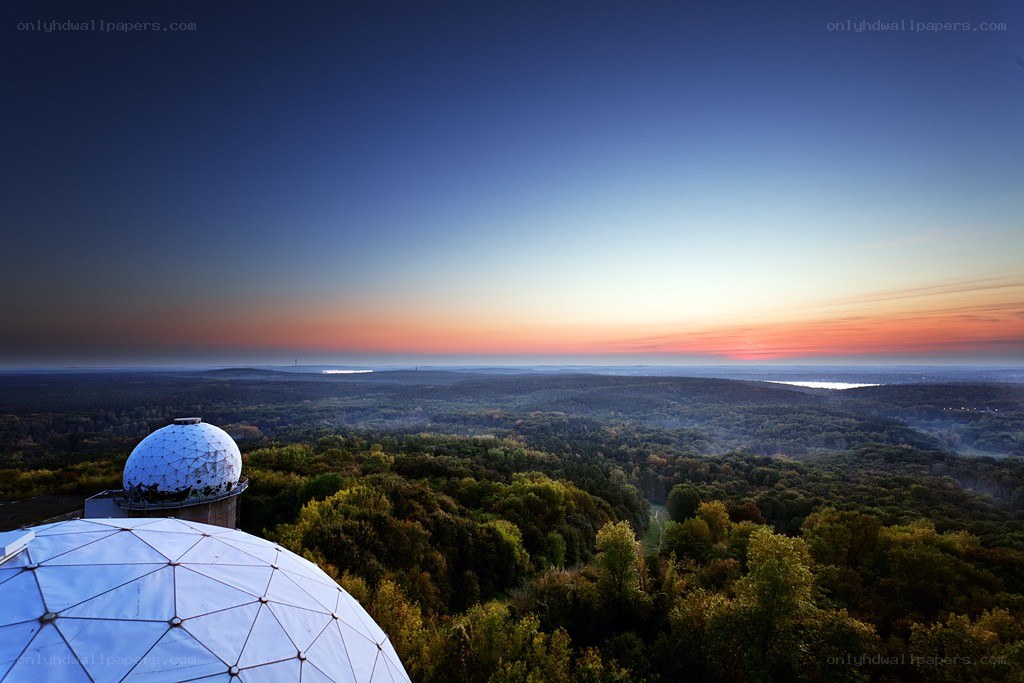 Domes over forest at sunset