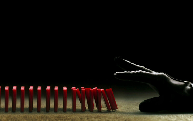 domino effect with hand