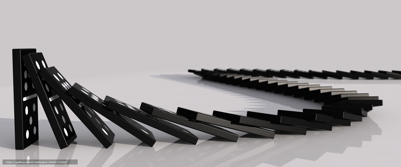 dominoes falling in chain reaction