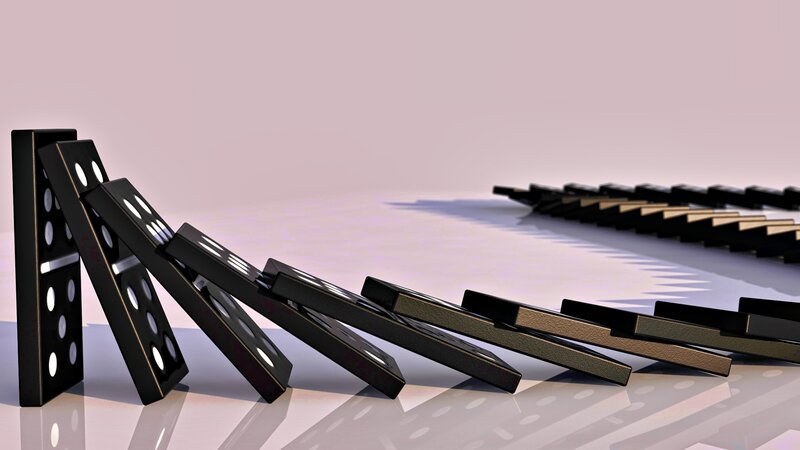 dominoes falling in sequence