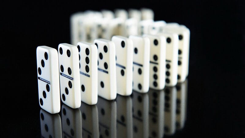 Dominoes in a Line — White, Dramatic, Photograph, Black Surface, Reflection
