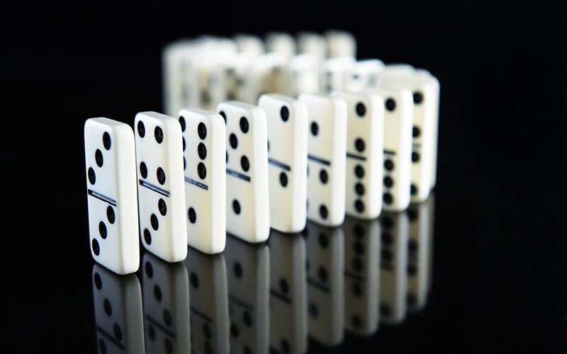 Dominoes in a Line — White, Dramatic, Photograph