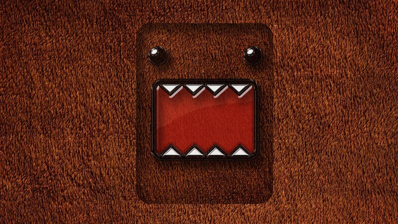 Domo character on brown fabric
