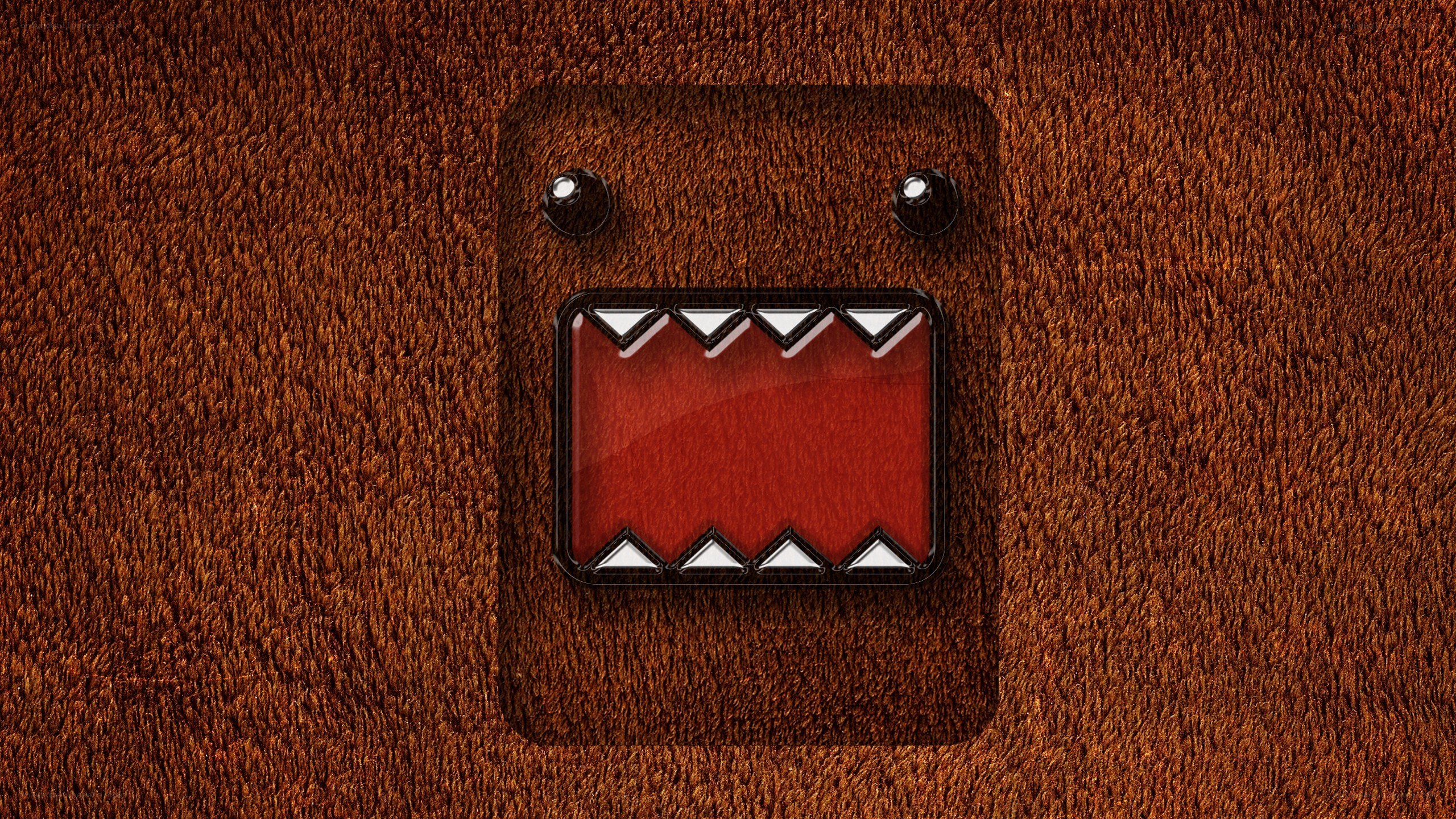 Domo character on brown fabric