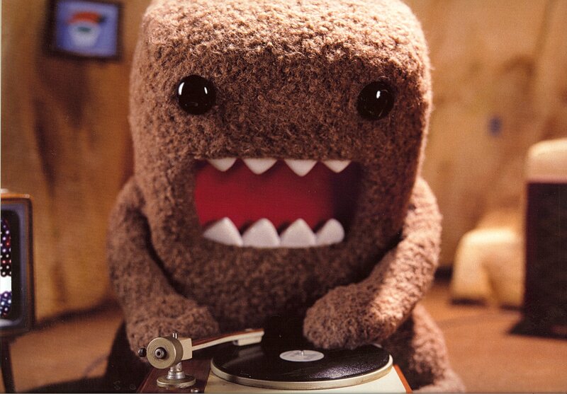 Domo character on record player