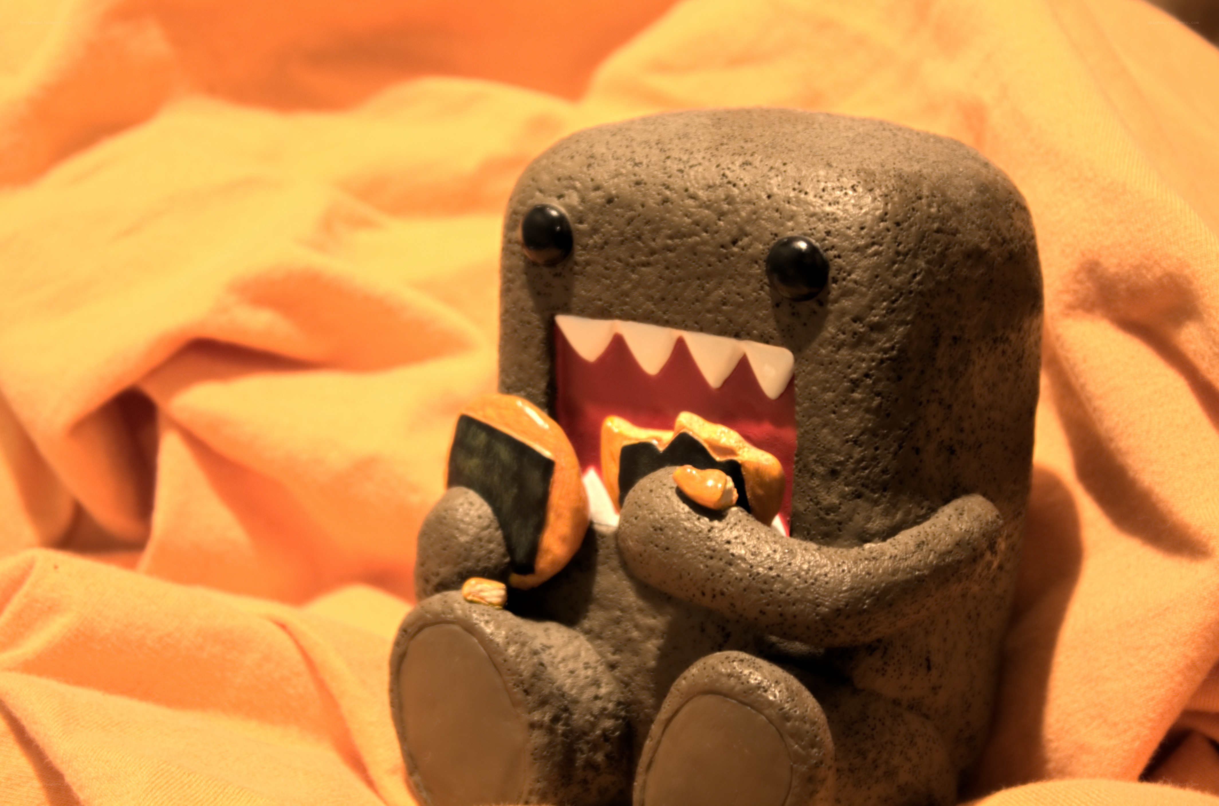 Domo figurine eating snack