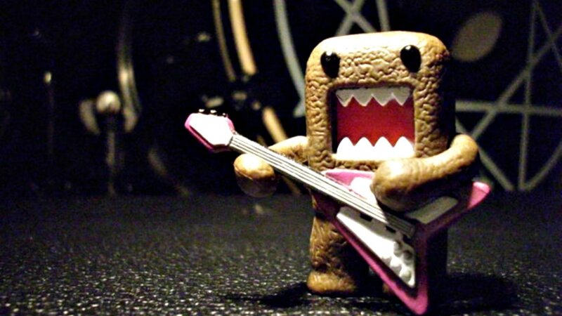 Domo Figurine Playing Guitar