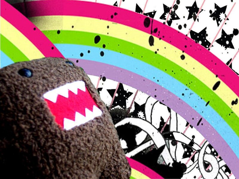 Domo plush with rainbow background