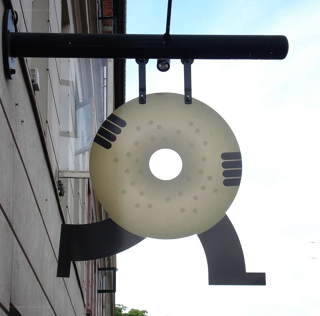 donut-shaped sign on building