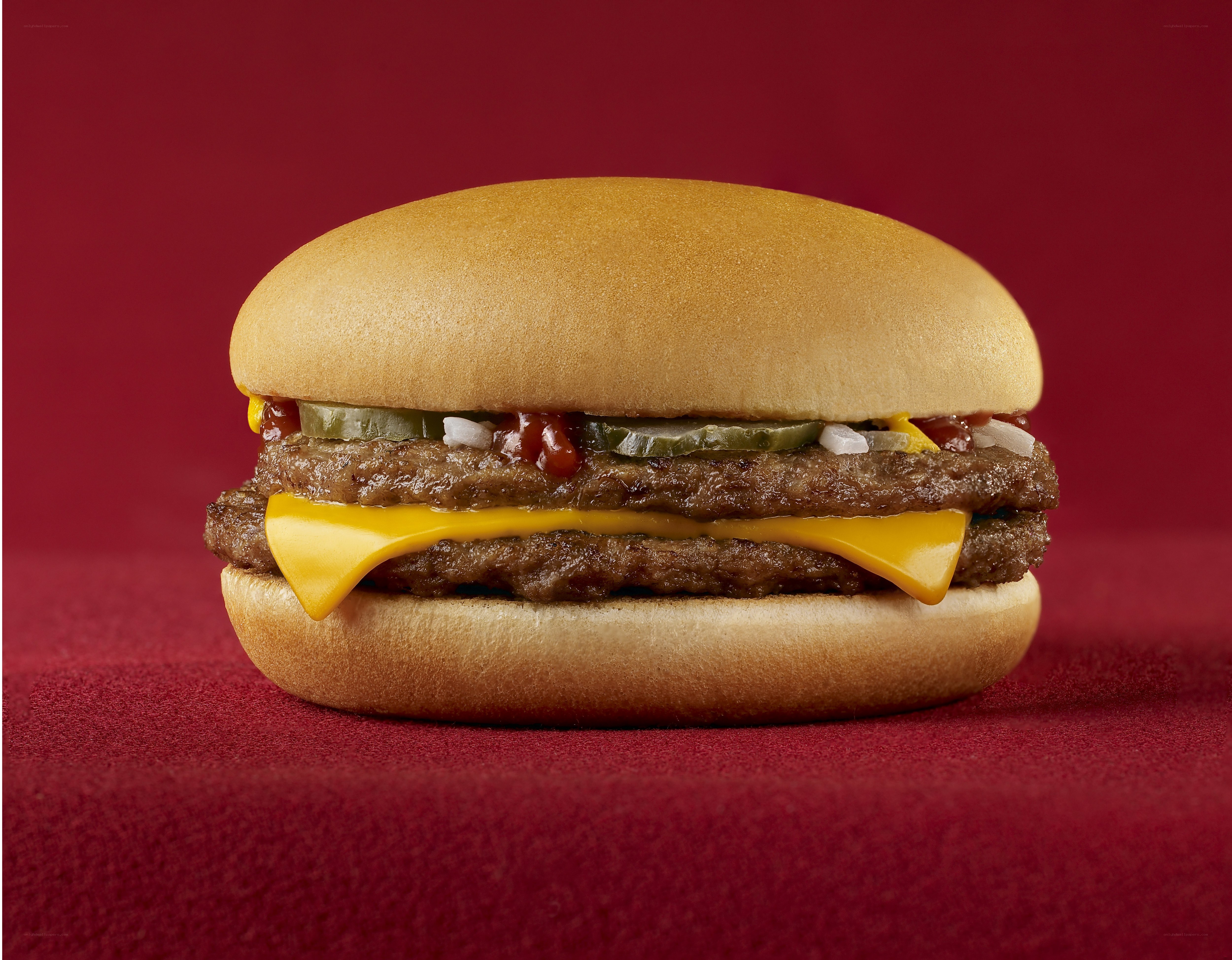 Double cheeseburger on red