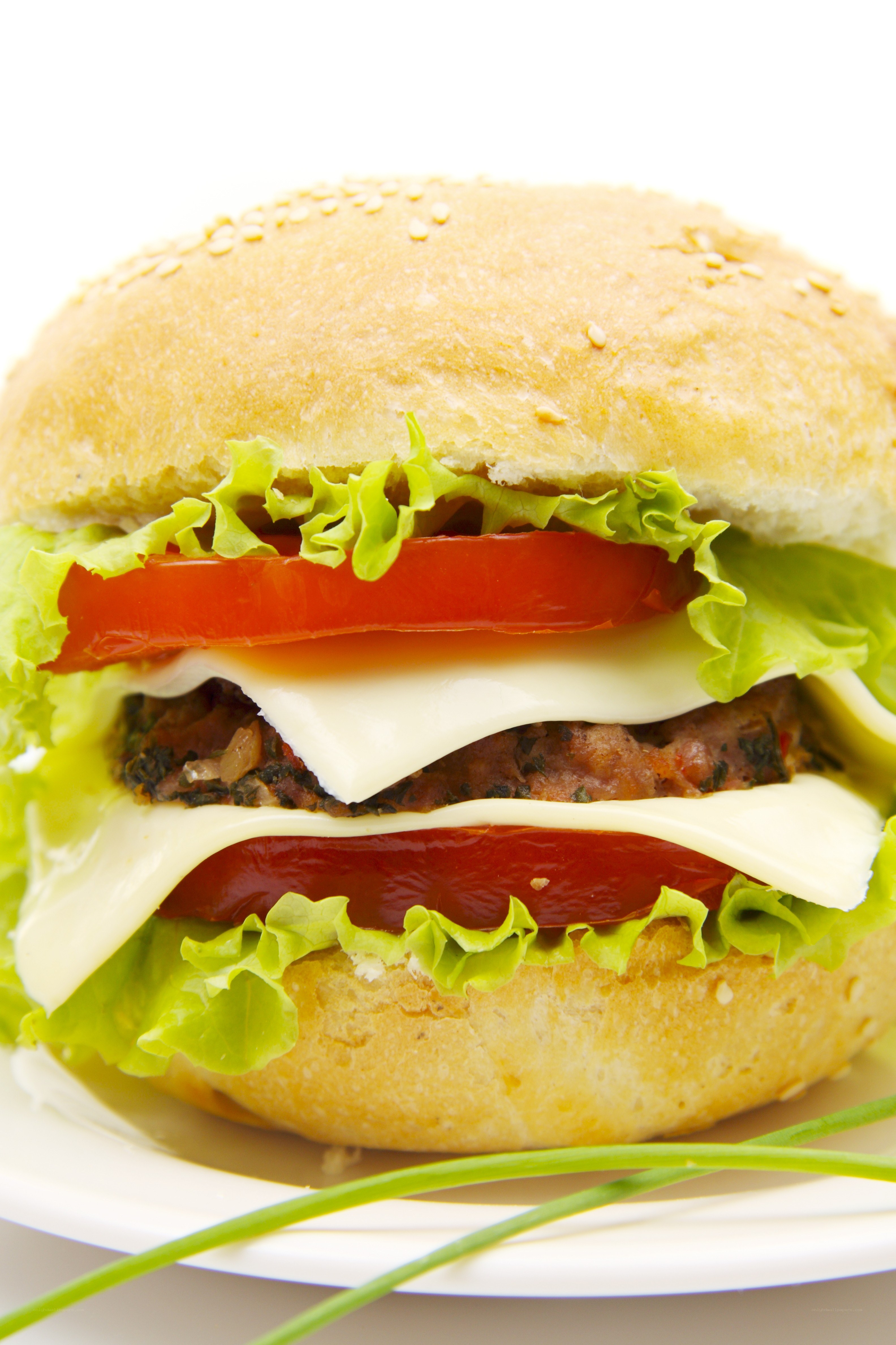 Double cheeseburger with lettuce and tomato