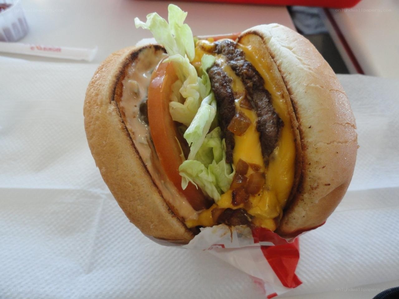Double cheeseburger with lettuce and tomato