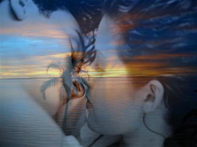 double exposure of couple and sunset