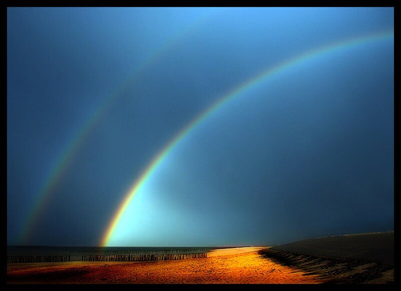 Double rainbow over beach