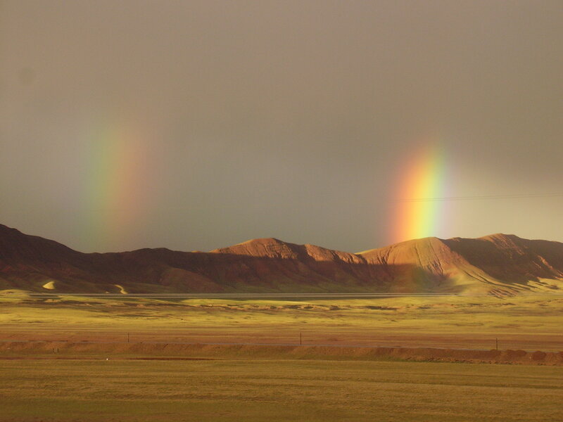 Double rainbow over mountains