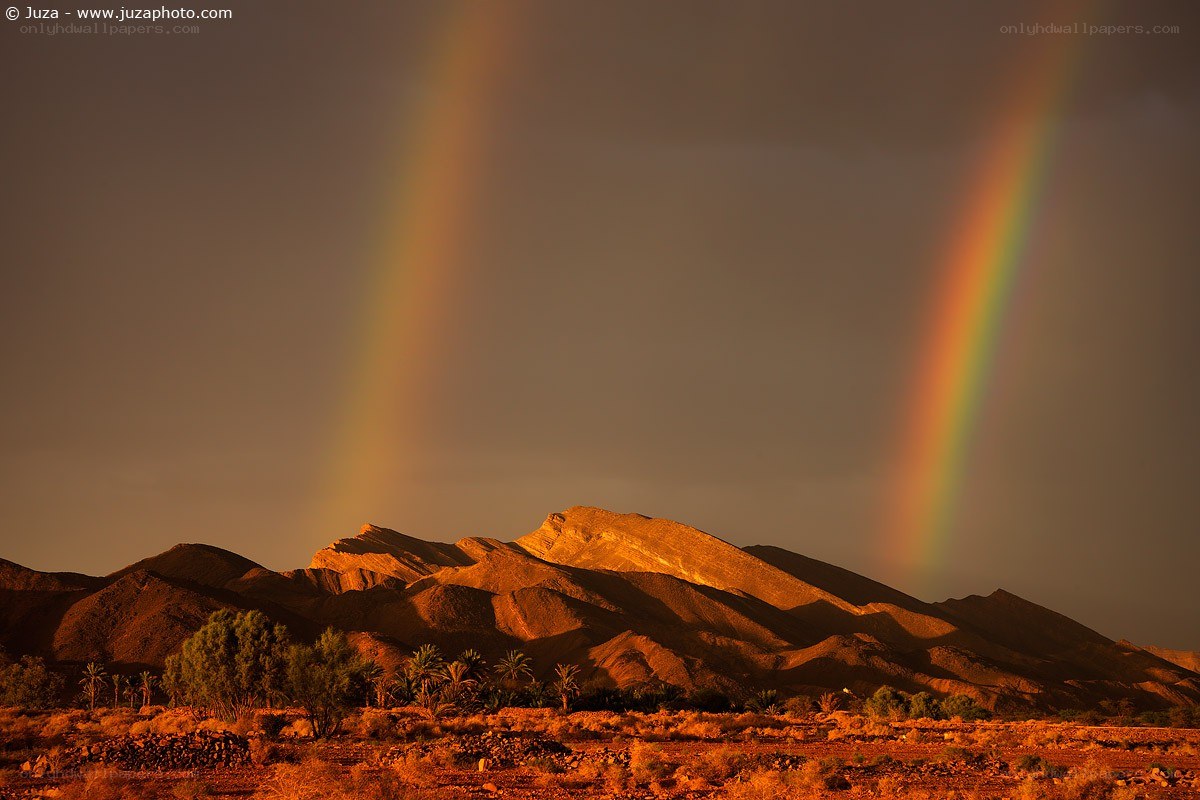 Double rainbow over mountains