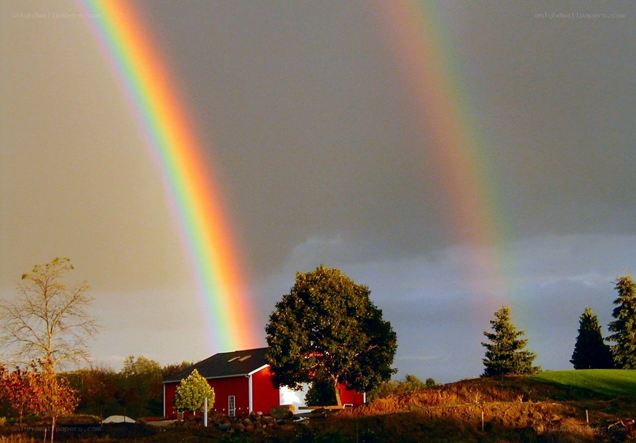 Double rainbow over red barn