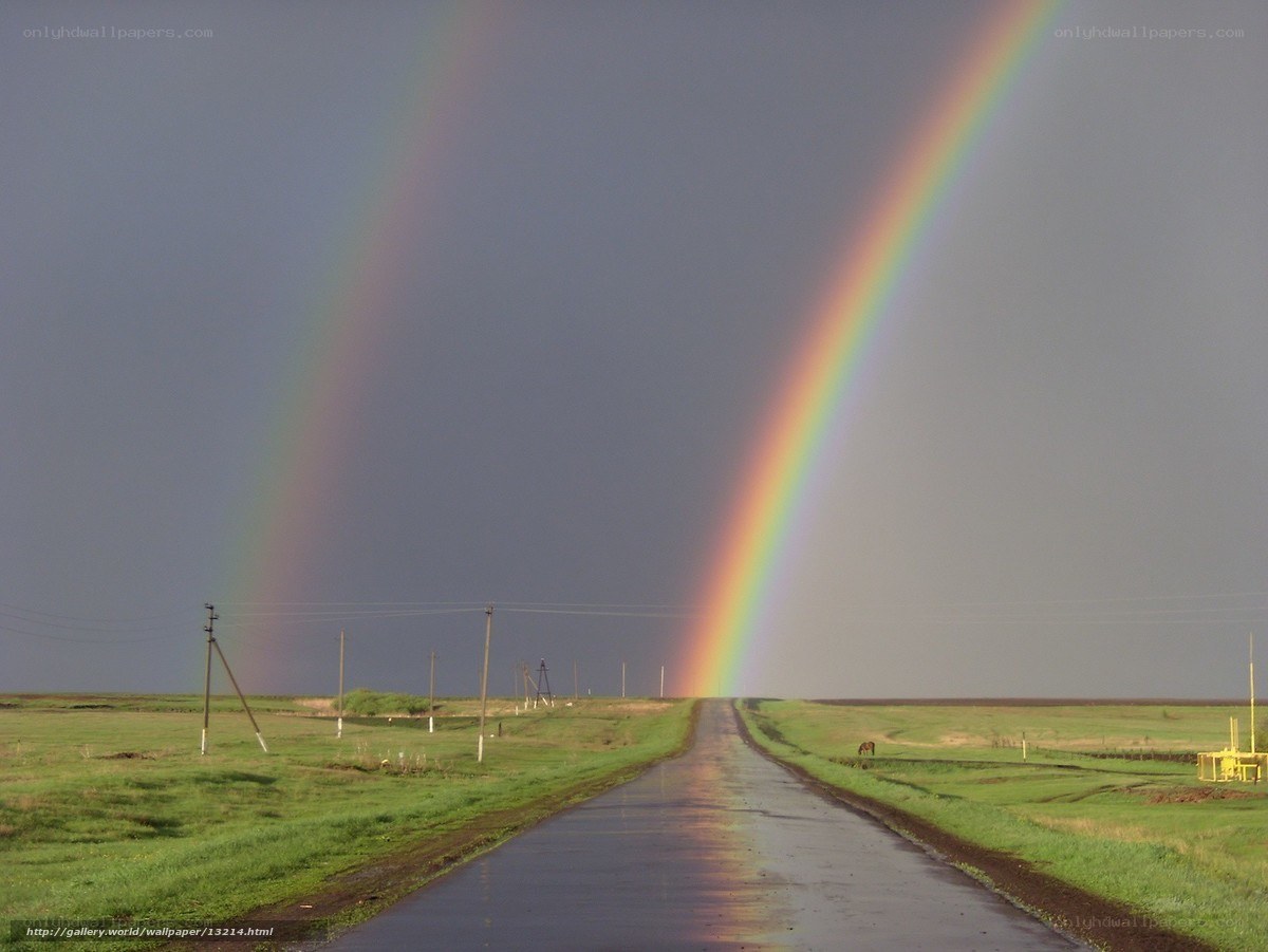 Double rainbow over rural road
