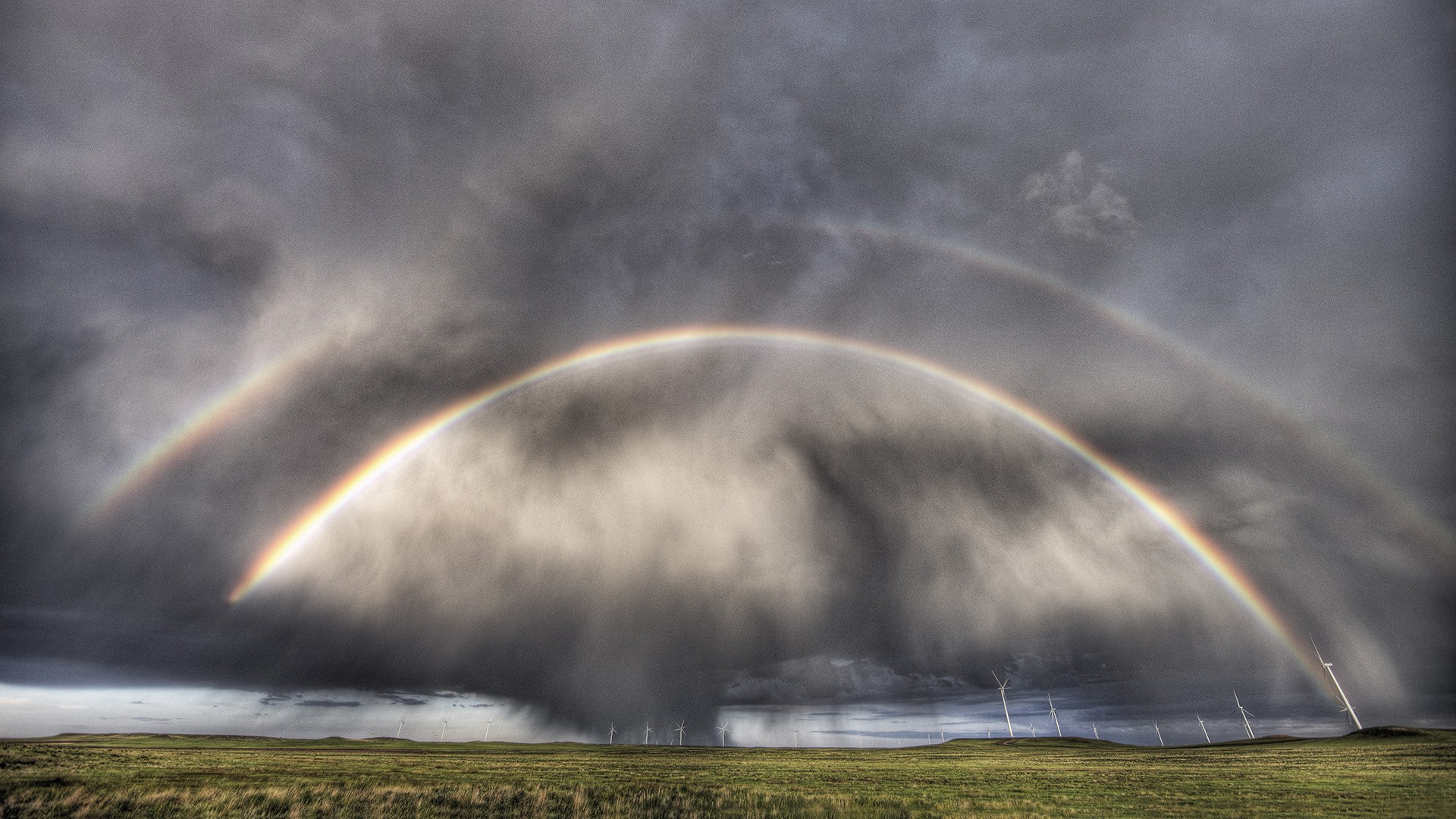 Double rainbow over wind farm