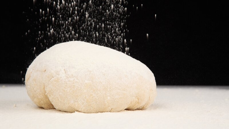 dough being dusted with flour