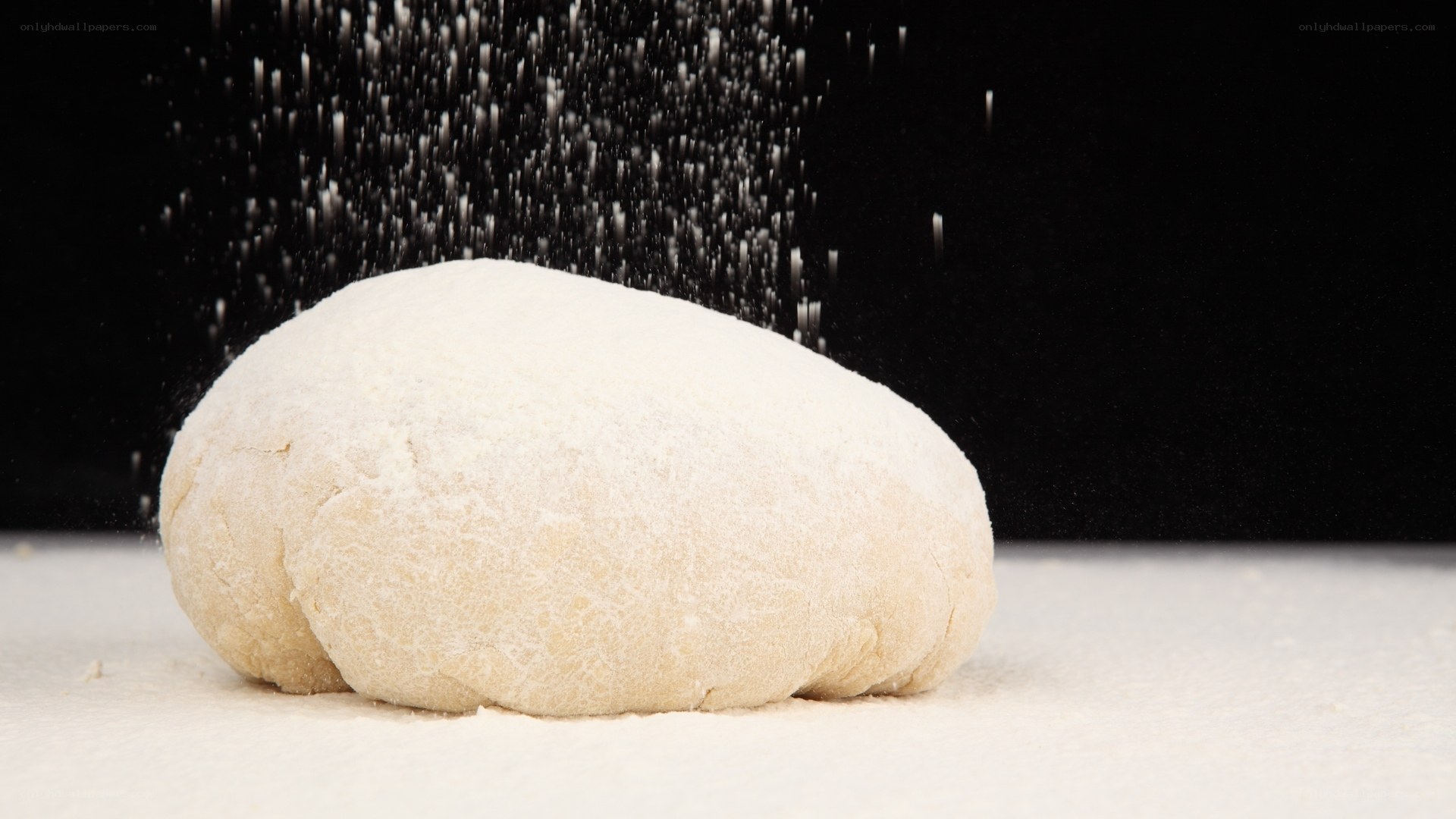 dough being dusted with flour