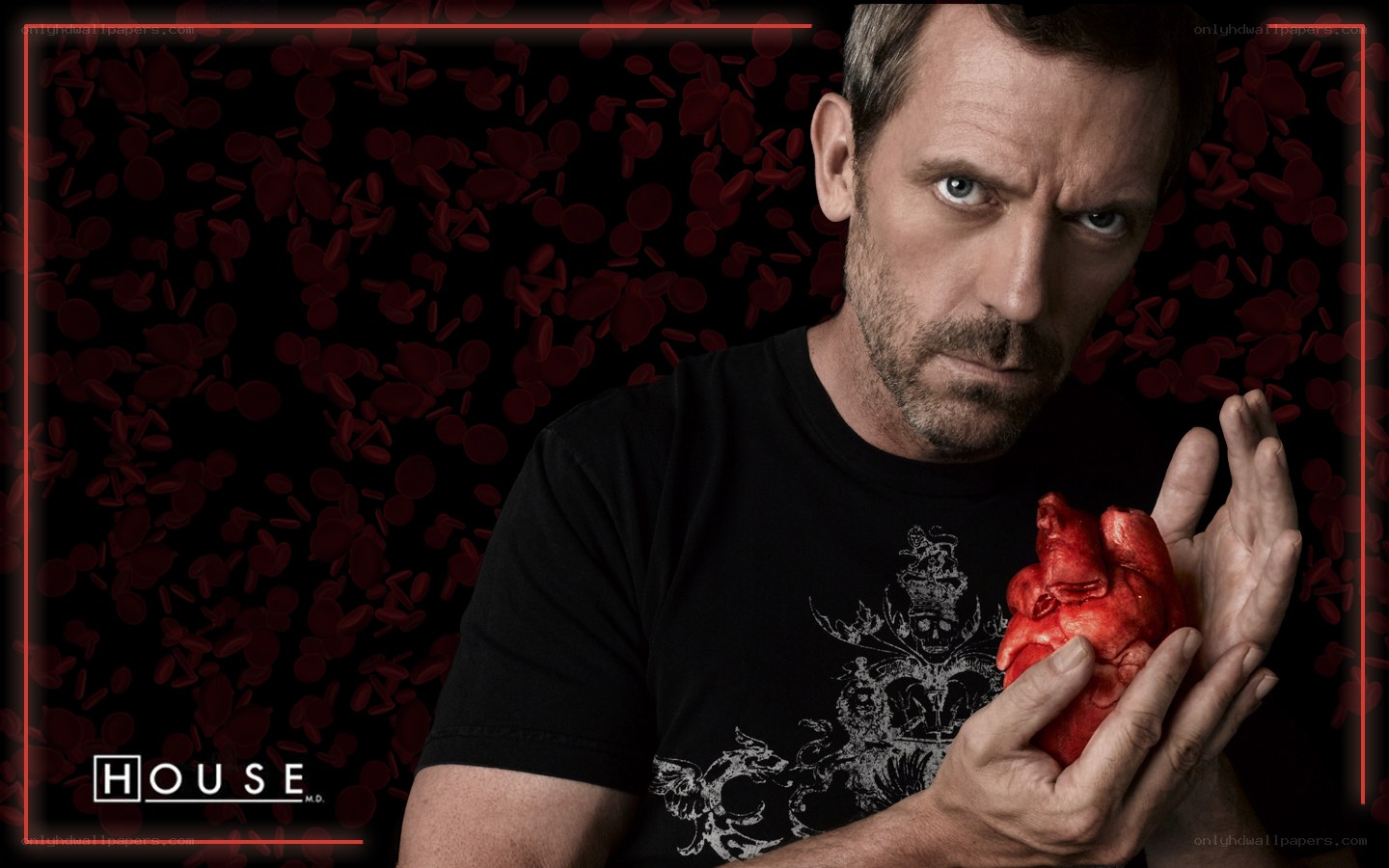 Dr. House holding a heart