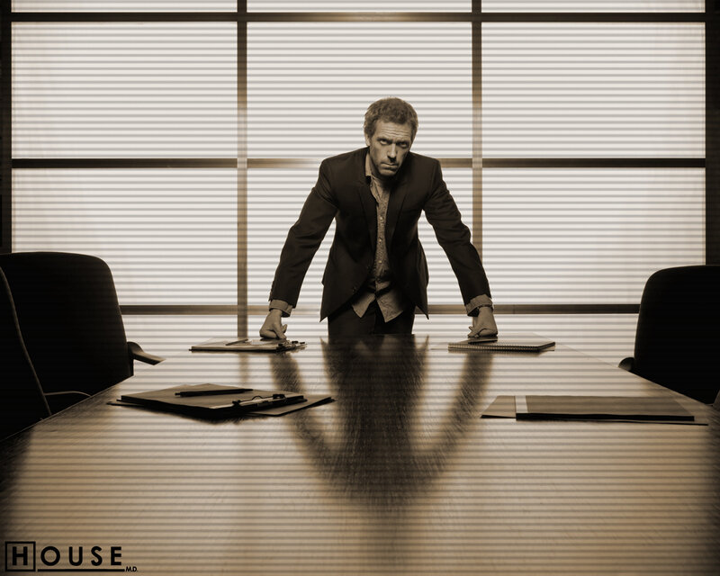 Dr. House in a conference room