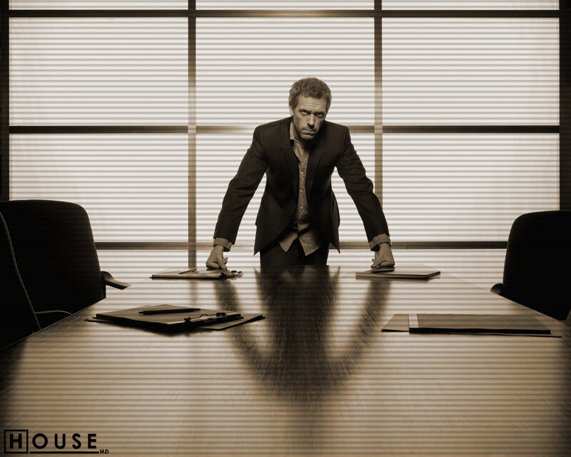 Dr. House in a conference room