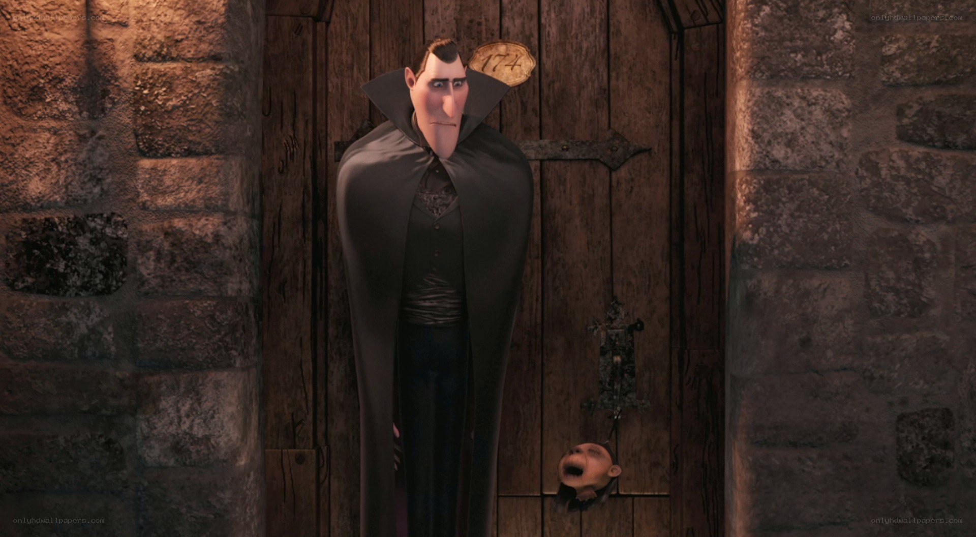 Dracula stands in a castle corridor