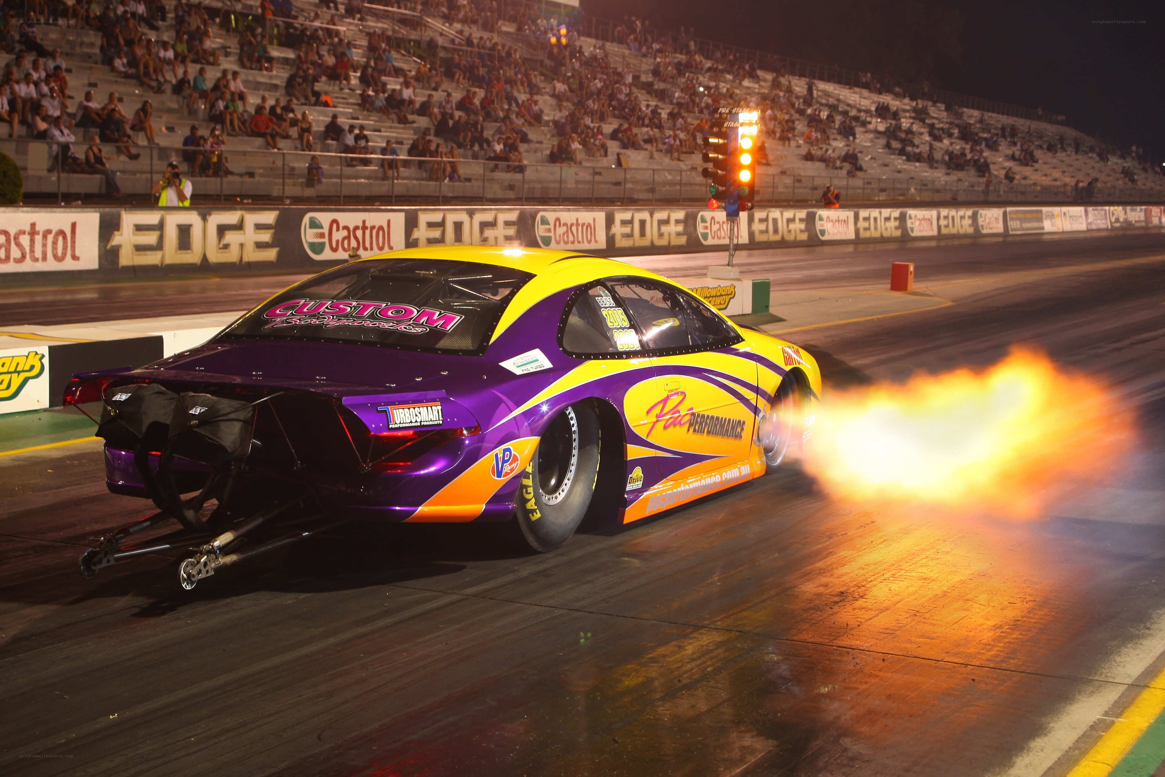 Drag racing car at night