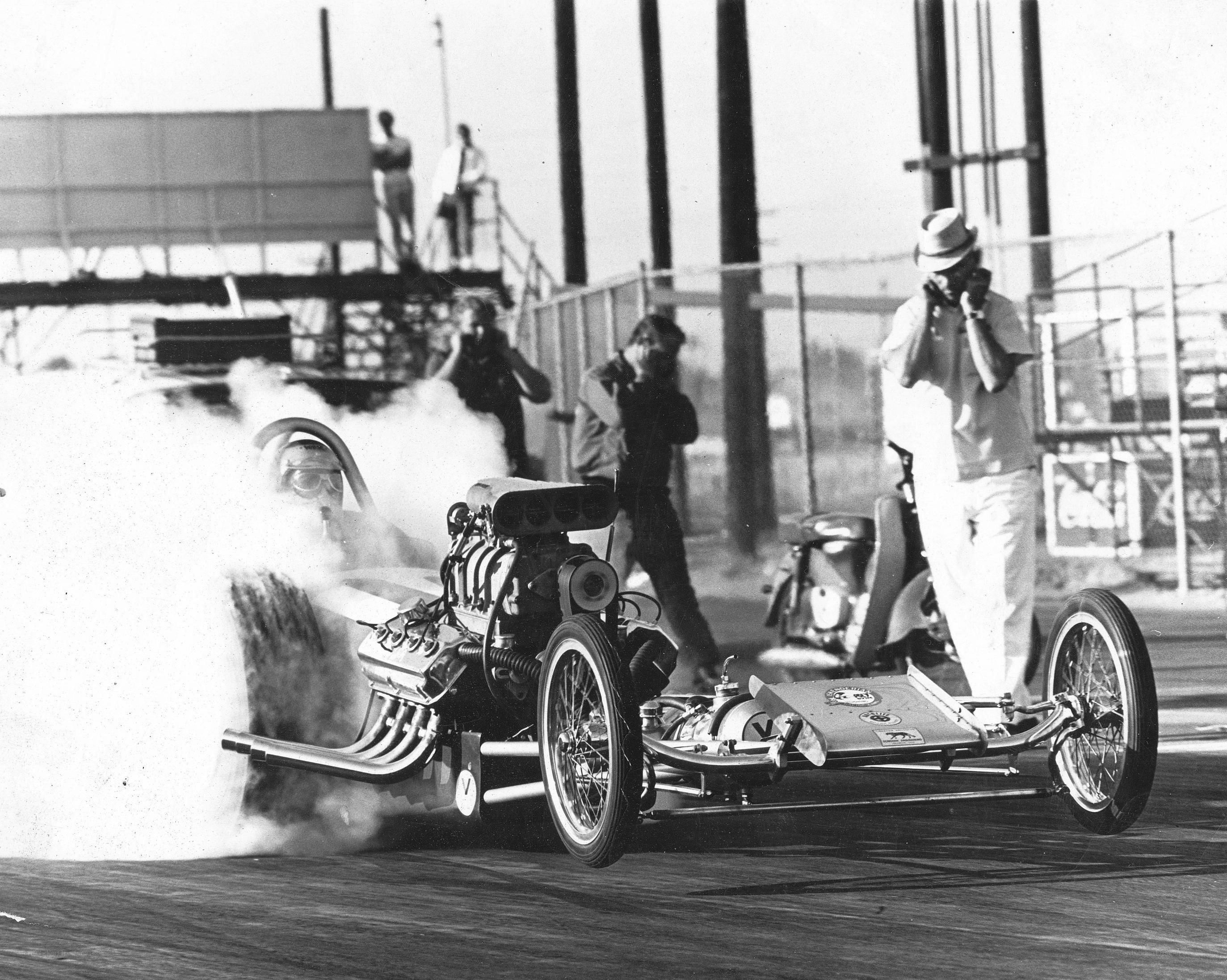 Drag racing car performing burnout