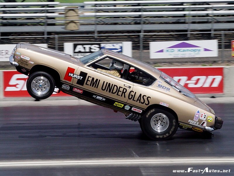 drag racing car performing wheelie