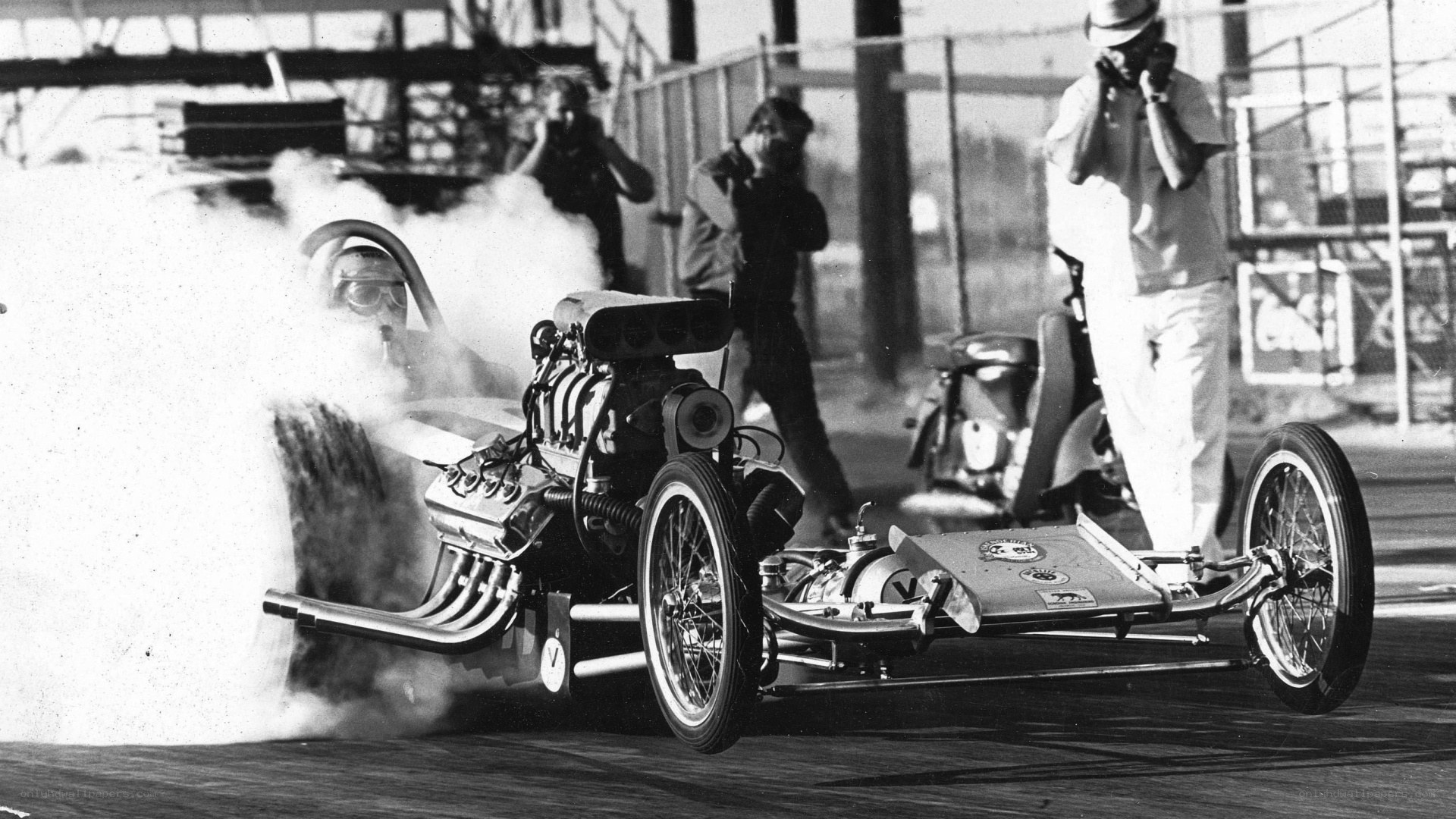 Drag racing car with smoke