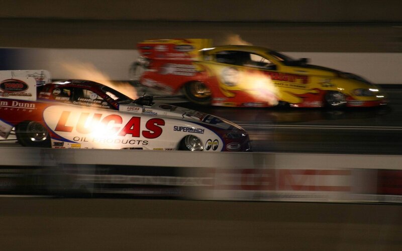 Drag racing cars in motion