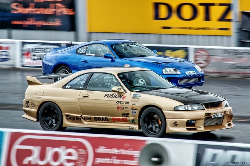 Drag racing cars on track