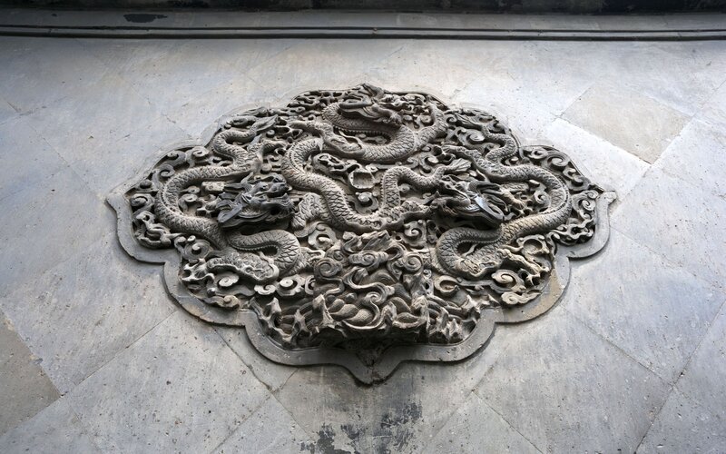 Dragon carving on stone wall