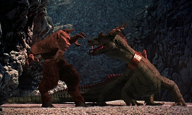 dragon confronts creature in cave