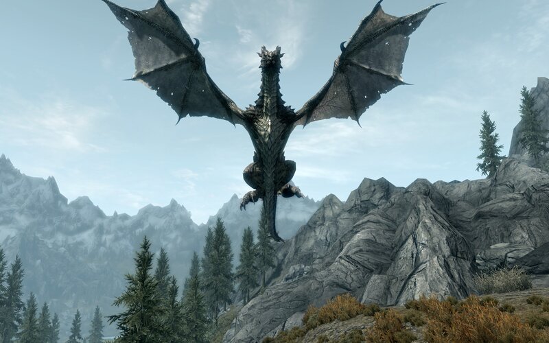 dragon flying over mountains