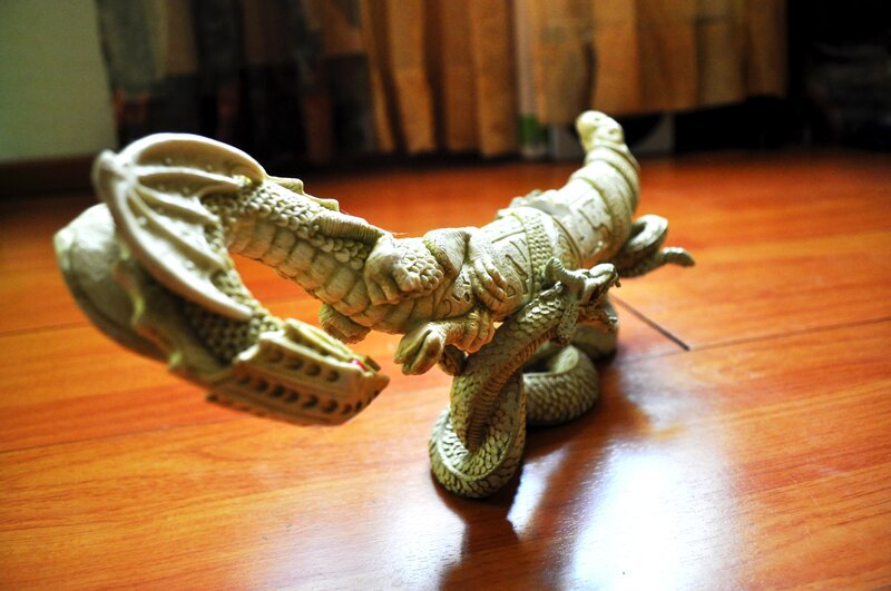 dragon sculpture on wooden floor